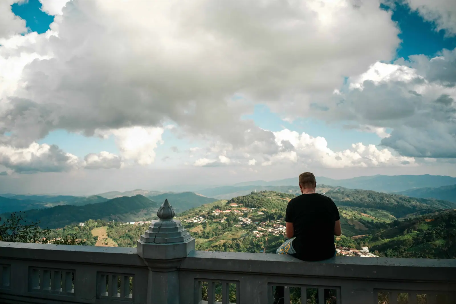 A rider overlooking the mountain landscape of Northern Thailand
